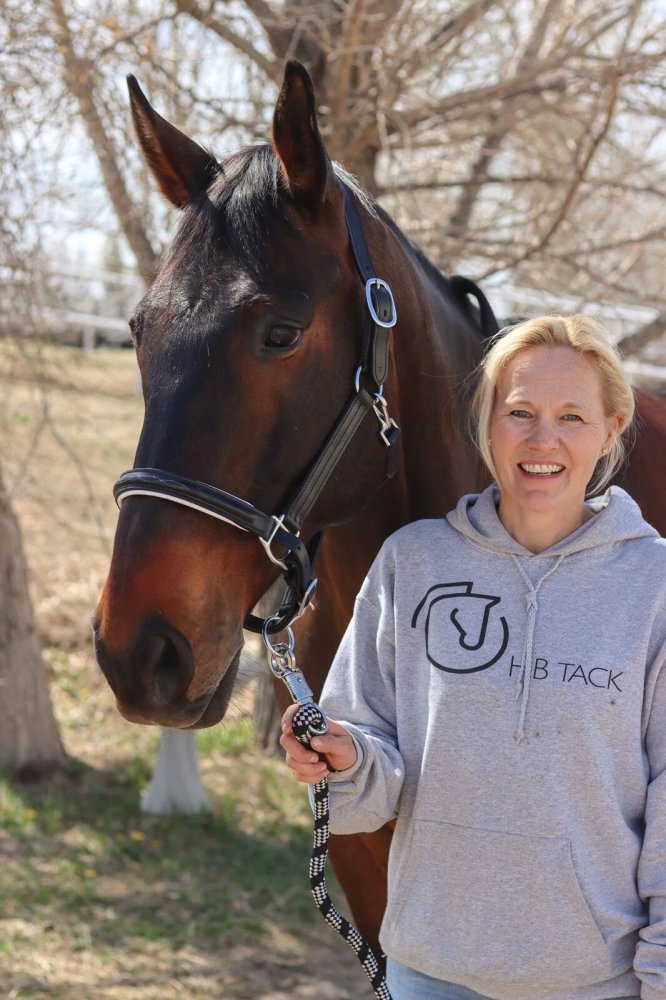 HB Tack's founder with a bay horse